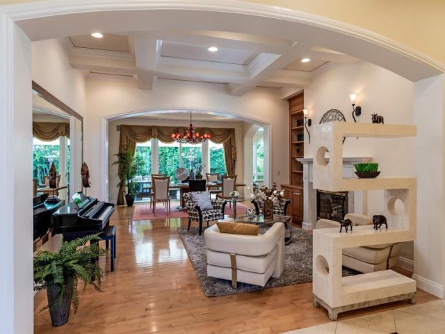 A living room filled with furniture and a fireplace.