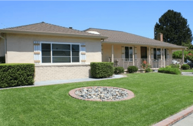 A house with a garden in the front yard